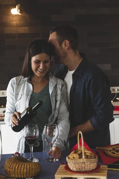 Young couple of lovers celebrating at home drinking wine — Stock Photo, Image