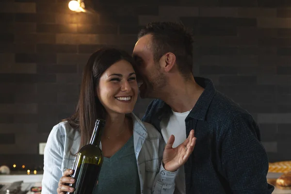 Young couple of lovers celebrating at home drinking wine — Stock Photo, Image