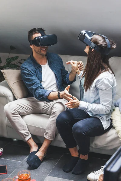 Young loving couple playing video games virtual reality glasses — Zdjęcie stockowe