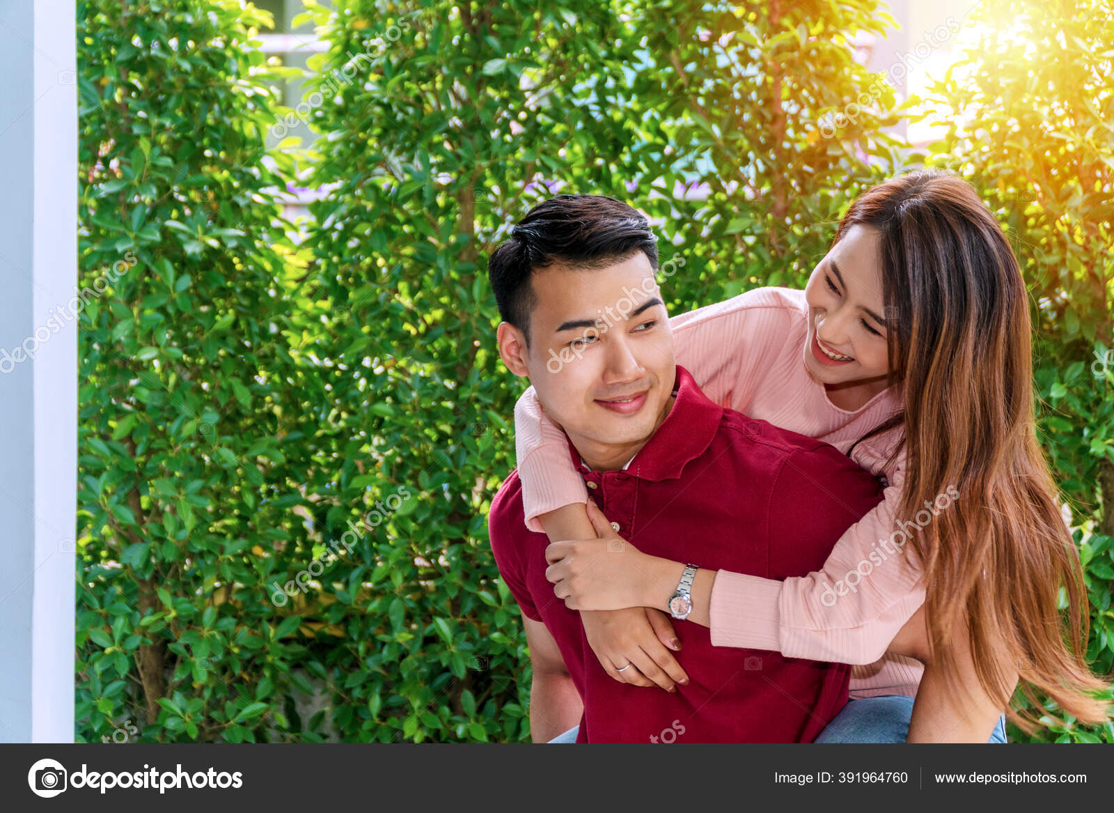 Young Man Giving Woman Piggyback Outdoors, Stock image