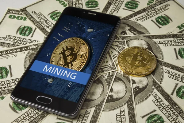 Bitcoin ile dolar yığını üzerinde bitcoin bir resim ile Smartphone