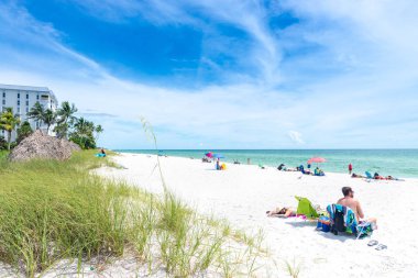 Naples, USA - jun 13, 2018: View of Naples beach in Florida on the mexican gulf clipart