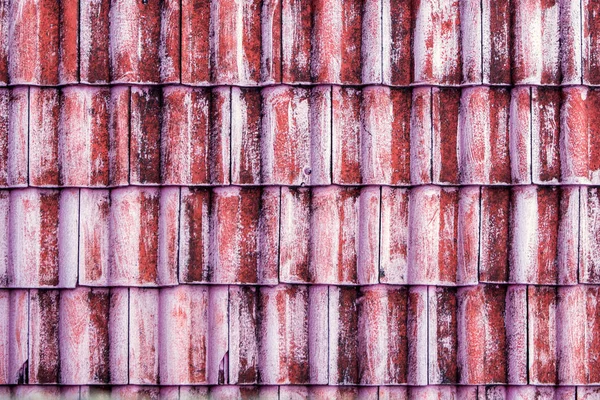 The old red tile on the roof