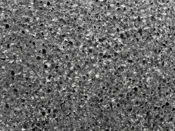 Μικρό Μαύρο Βράχο Τραχύ Τσιμεντένιο Πάτωμα — Φωτογραφία Αρχείου