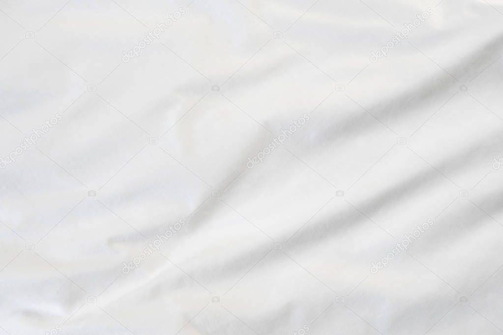 Texture of White blanket crumpled on the bed