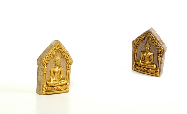 Gambar Buddha digunakan sebagai jimat yang dikompresi debu pada latar belakang putih — Stok Foto