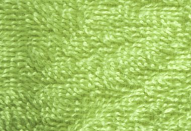 Yeşil banyo havlusunun doku yüzeyi.