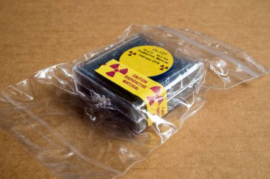 Small Radioactive seal source Cesium 137 in the Plastic package clipart