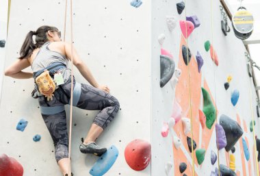 Yüksek bir duvara tırmanırken kadın duvar tırmanıcısı. Duvar tırmanma sp