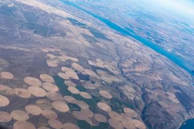 Aerial view of crop circles and crop squares from Idaho near the snake river. Circle shaped fields and square shaped fields clipart