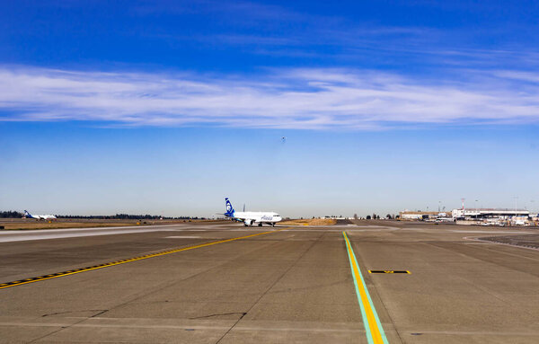 Seattle-Tacoma International Airport Runway Area with Alaska Airplane, Seattle USA, March 30, 2020