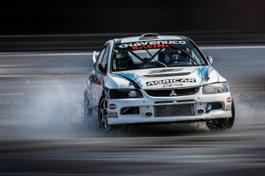 Milan, Italy, June 03, 2018: Mitsubishi Lancer Evolution in action during the 1st Drift Show Il Destriero at the Iper Drive in Milan. clipart