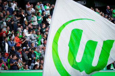 Wolfsburg, Germany, August 11, 2018: big Wolfsburg flag waving at the Volkswagen Arena during a soccer game. Photo by Michele Morrone.