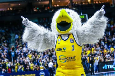 Berlin, Germany, October 04, 2019: the mascot of Alba Berlin entertains the audience during the EuroLeague basketball match between Alba Berlin and Zenit St Petersburg at Mercedes Benz Arena in Berlin. (Photo: Michele Morrone) clipart