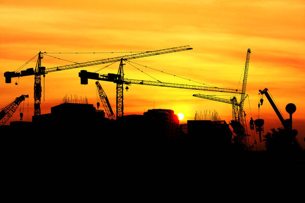 Silhouette Construction site with crane and building, Industrial crane construction.
