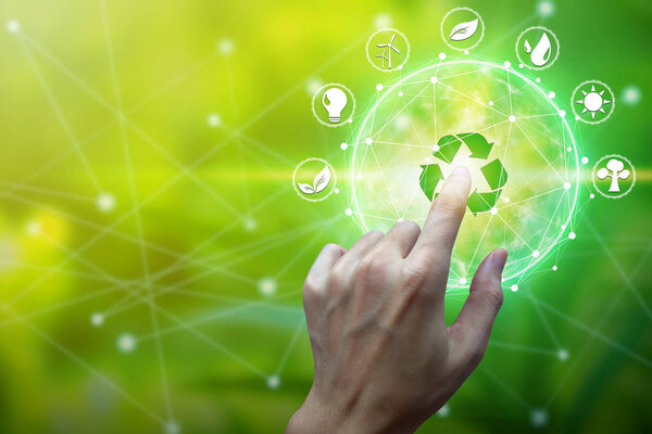Finger touch with environment Icons over the Network connection on nature background, Technology ecology concept.