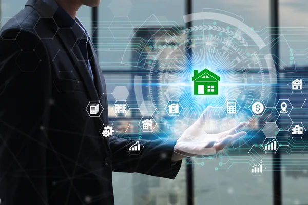 Hand holding with property investment Icons over the Network connection on property background, Property investment concept.