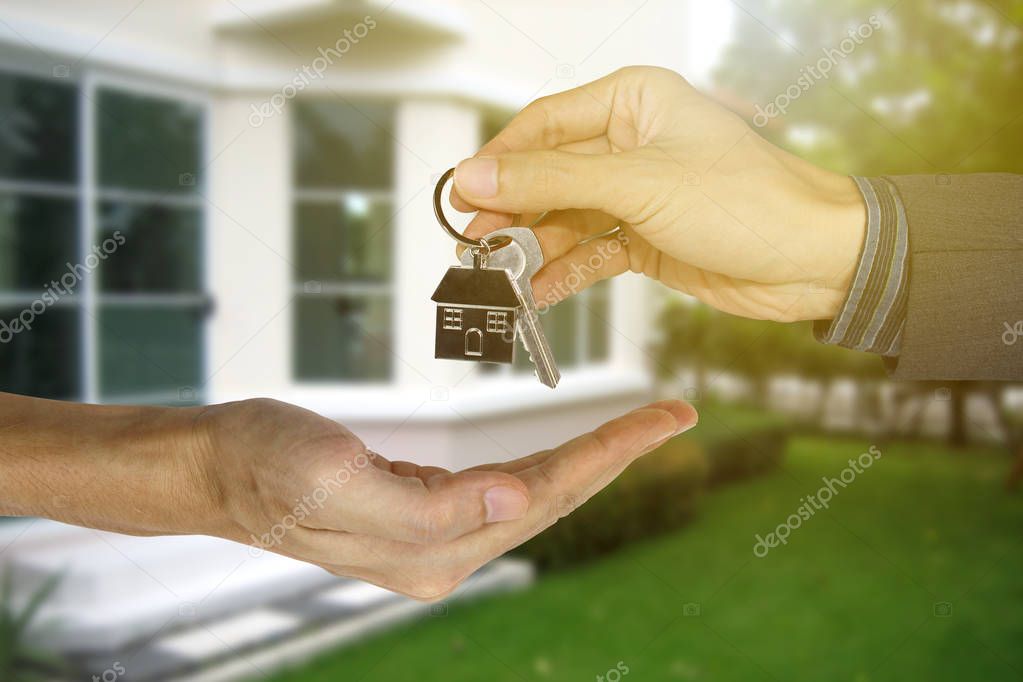 Giving house keys to customers, Property concept, Mortgage and a