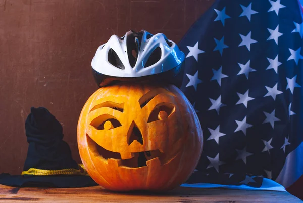 Halloween pumpkin, Jack-o-lantern in Bicycle helmet, us flag