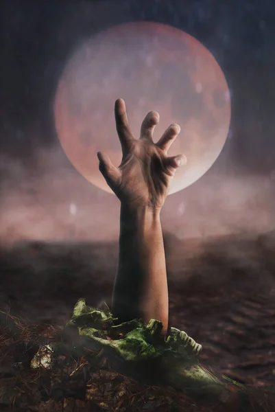 Scary zombie hand on moon background, risen from the dead, — Stock Photo, Image