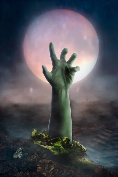 Scary zombie hand on moon background, risen from the dead,