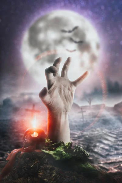 Scary zombie hand on moon background, risen from the dead,
