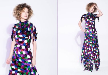 Moda parlak renkli elbiseli güzel bir genç kadın görüntüsü. Altın kıvırcık saçları ve hafif makyaj. Tarafsız beyaz arka plan