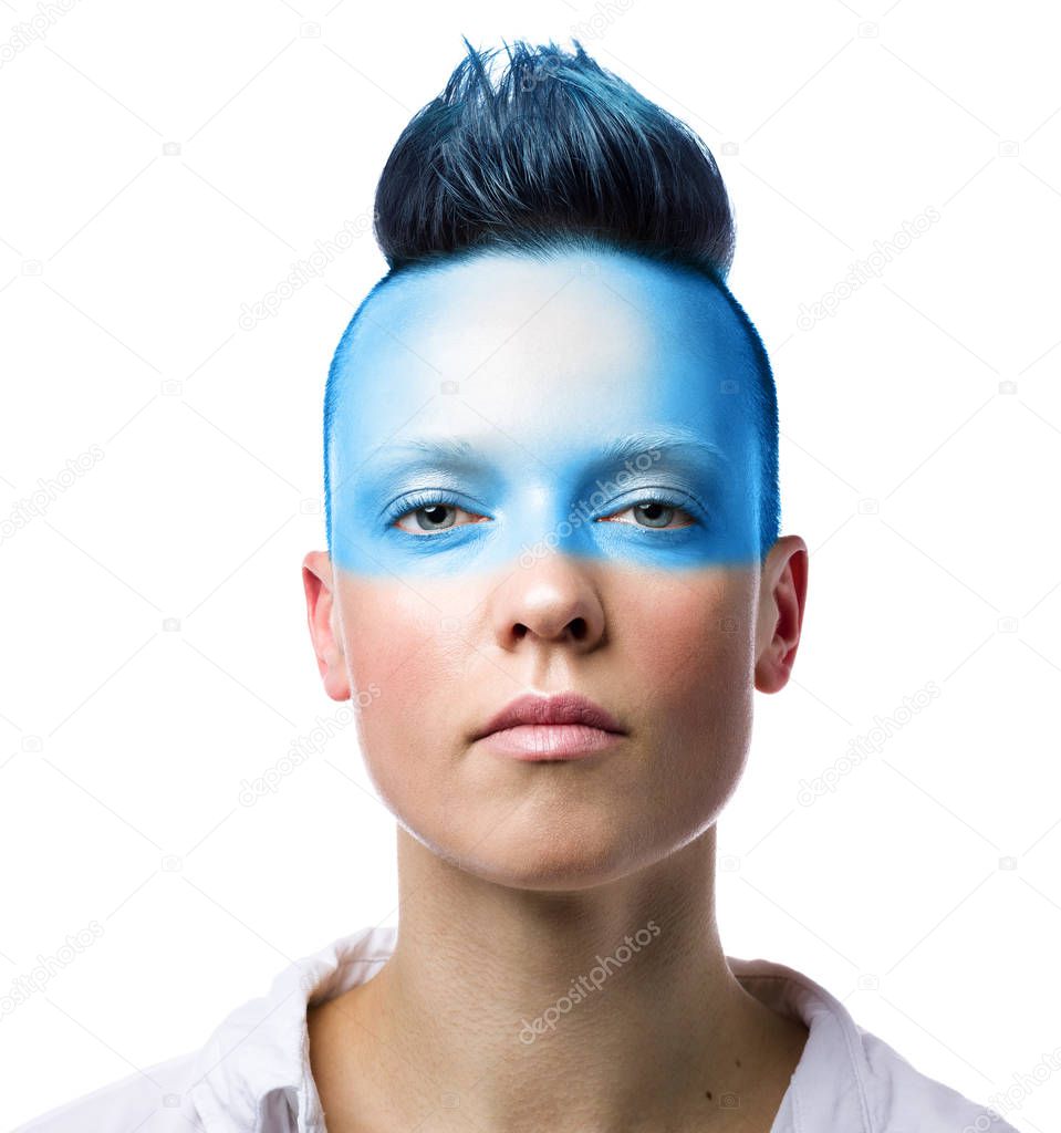 Conceptual portrait of a young punk woman with blue makeup. Isolated on white backgroun