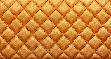 Rhombic dikiş ile hakiki deri dokusuna yakın çekim. Zengin altın renk