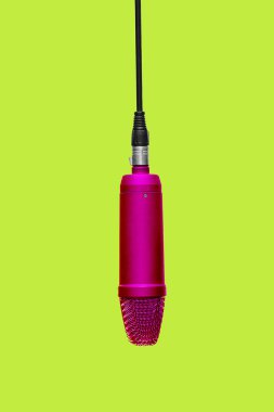 Red Condencer Mic Hanging In Studio Isolated On Yellow Backgrround - Complimentary Colors clipart