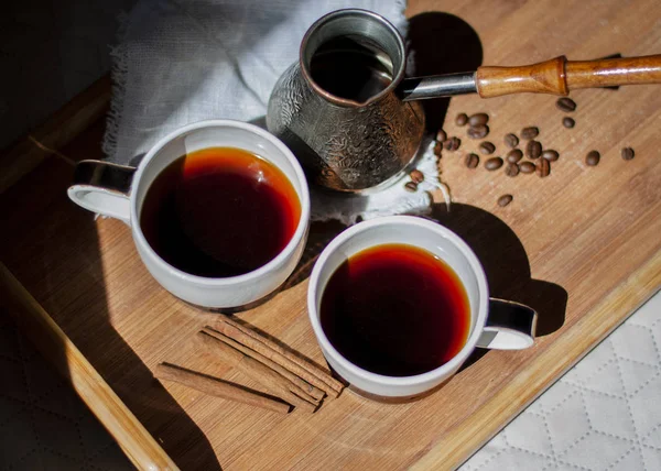 Metal turk and two coffee cups on wooden tray background — Stock Photo, Image