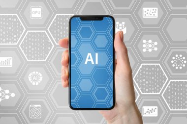 AI / yapay zeka kavramı. Modern çerçevesiz smartphone simgeleri ile nötr arka plan önünde tutan el 