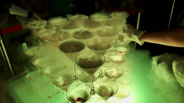 Pyramid of champagne with liquid nitrogen. Colorful led lights — Stock Video