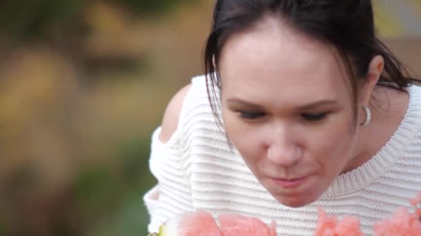 Girl eating watermelon in the Park. slow motion video lifestyle. the concept of the girl and the watermelon — Stock Video