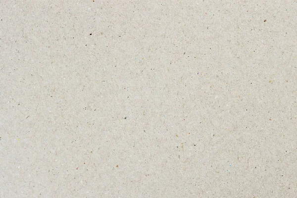 Textura de papel crema claro orgánico, fondo para el diseño con texto o imagen de espacio de copia. Material reciclable, tiene pequeñas inclusiones de celulosa — Foto de Stock