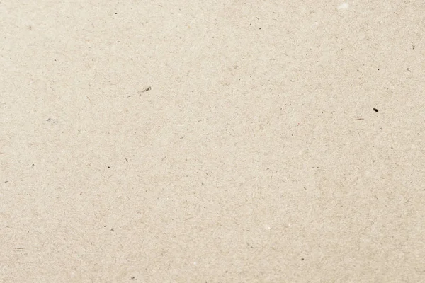 Textura de papel creme leve orgânico velho, fundo para design. Material reciclável, tem pequenas inclusões de celulose — Fotografia de Stock