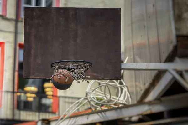 Street basketball game. Basketball shield, ball going through basket. Concept of sport, hit accuracy, active lifestyle