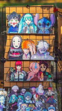 BURGAS, BULGARIA - AUGUST 01, 2025: Colorful anime merchandise, stickers are displayed on racks and tables at a market. Concept of anime culture, collectibles, Japanese pop entertainment, hobby