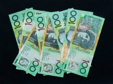 One hundred dollar notes on black background, Australian currency $100 clipart