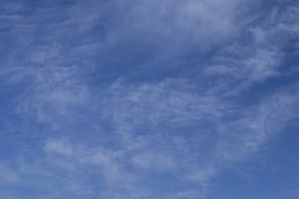 blue sky with haze of clouds