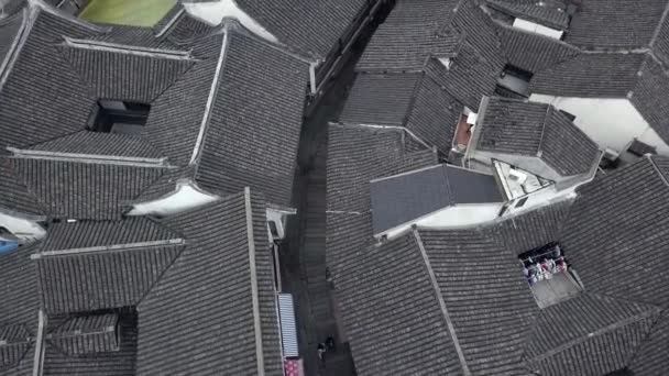 From above Picturesque grey roofs ceramic tile Zhujiajiao Ancient water Town Shanghai style China Venice historical authentic traditional old houses Ming Qing Dynasties street Travel Sight. Aerial Top — Stock Footage Picturesque Grey Roofs Ceramic Tile Zhujiajiao Ancient Water Town Shanghai Royalty Free Stock Video