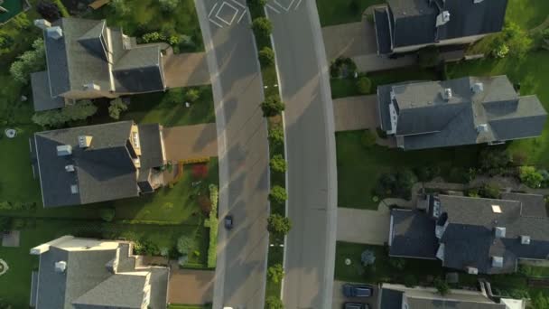 Aerial top down cottage village townhouses elite individual large houses villas roofs. Asphalt road goes man to car. Construction comfort housing development Business sales realtor. Sunny positive day — Stock Footage Aerial Top Cottage Village Townhouses Elite Individual Large Houses Villas Stock Video