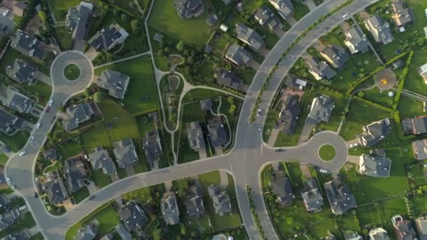 Follow car through cottage village many houses villas structure pattern design project from height. Modern elite luxury comfortable housing. Countryside outskirts landscape. Secluded green area. Drone — Stock Footage Follow Car Cottage Village Many Houses Villas Structure Pattern Design Video Clip