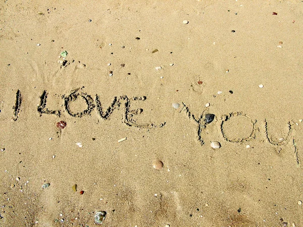 Iinscription on love on the sea beach