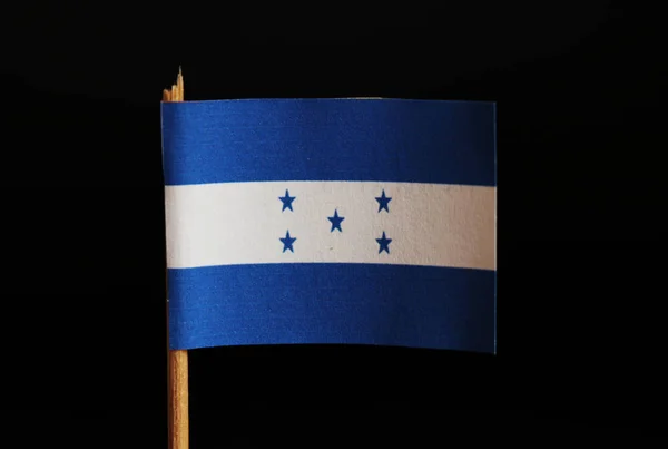 Μια Επίσημη Σημαία Της Ονδούρας Σχετικά Οδοντογλυφίδα Και Μαύρο Φόντο — Φωτογραφία Αρχείου