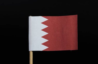 Kürdan siyah arka plan üzerine bir ulusal bayrağını Bahreyn. Bir beyaz alan vinç tarafında bir zikzak desen şeklinde beş beyaz üçgen tarafından anında büyük bir kırmızı alanından ayrılmış.