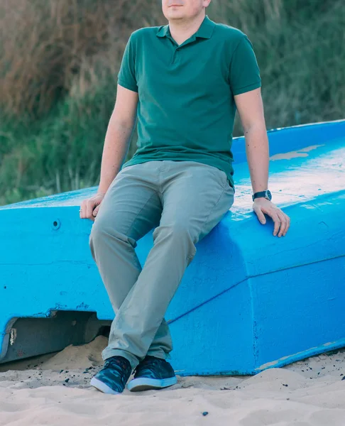 Portrait of rugged middle aged man standing at the summer beach