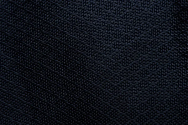 Czarny materiał tekstury tła. Szczegóły płóciennego materiału włókienniczego. — Zdjęcie stockowe