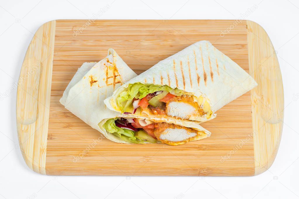 Chicken Shaverma or Doner Kebab with Vegetables on a White Plate Close Up.
