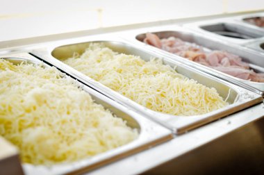 Food catering varieties background. Close up top side view, cooking using stainless steel dishware